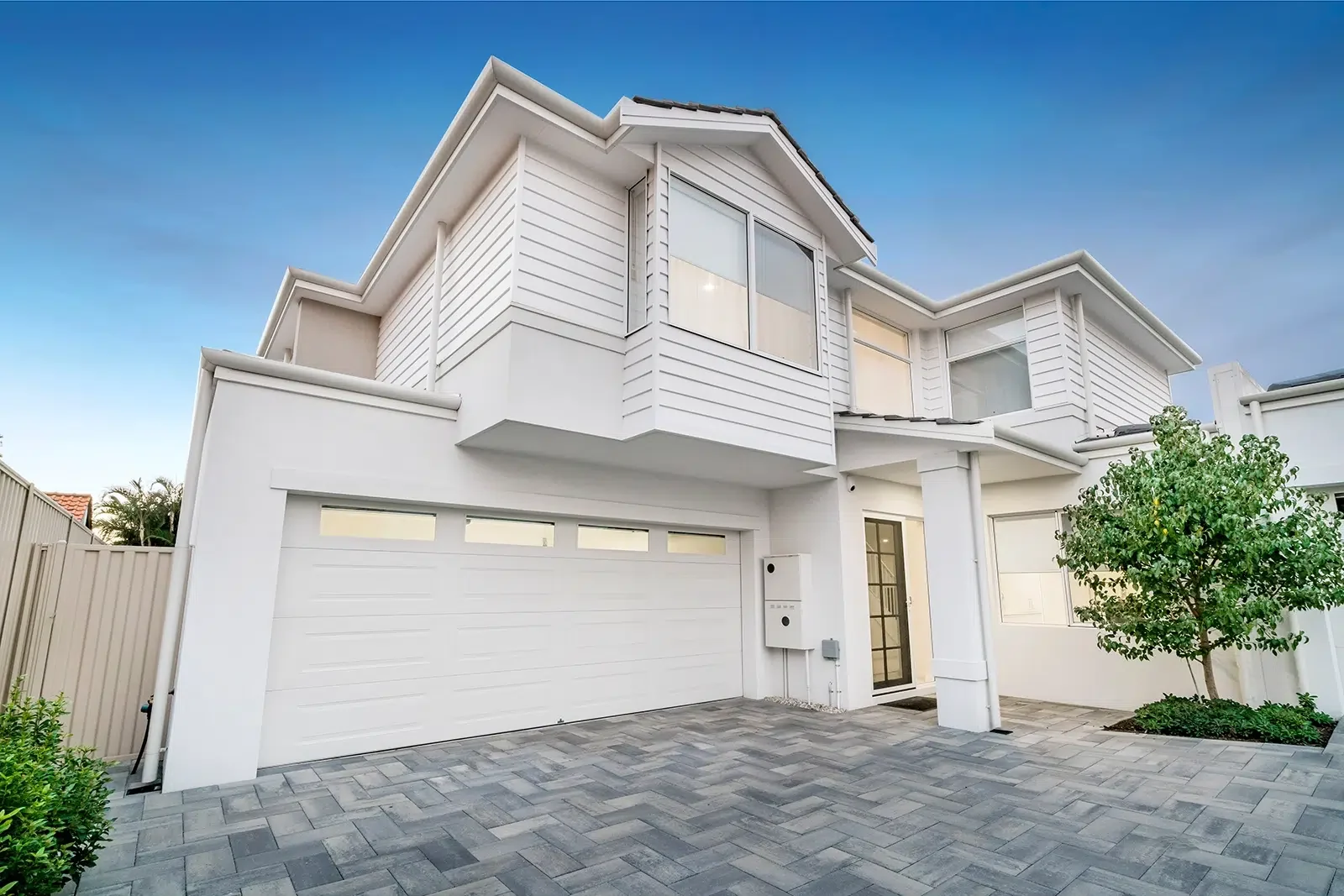A large white home with freshly painted by Prime Coat, Residential Exterior Painters in Cairns, Qld