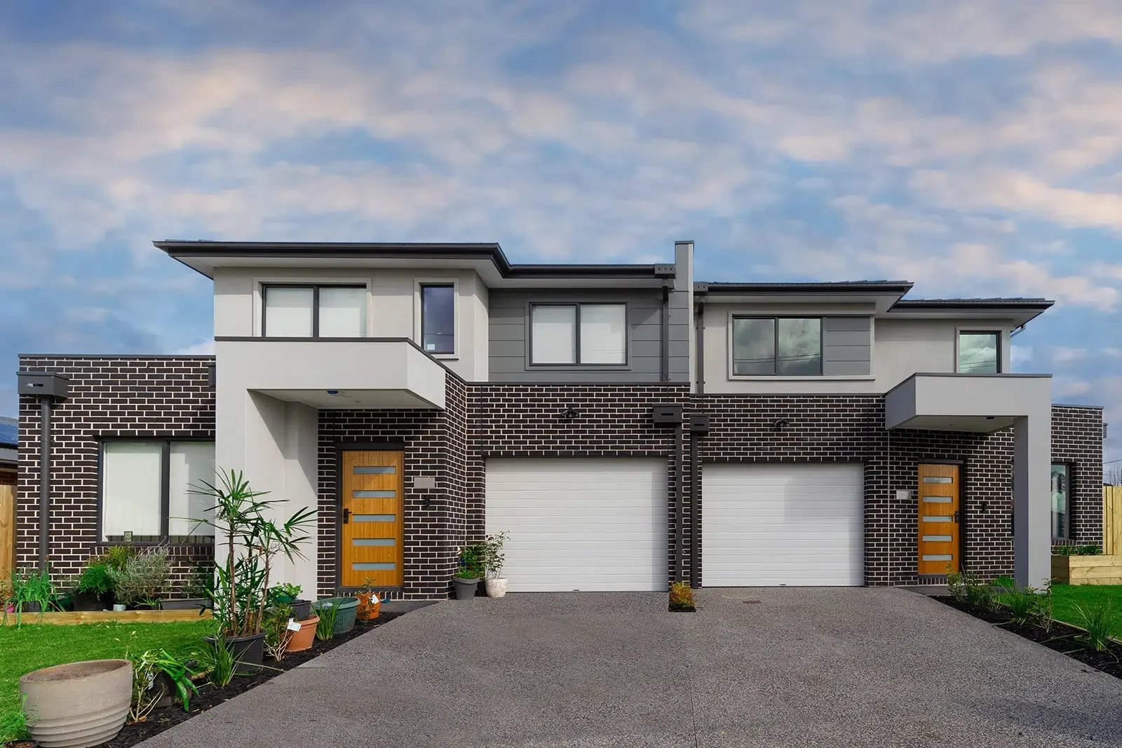 Multi unit painting of modern veneer brick properties in Cairns, Qld